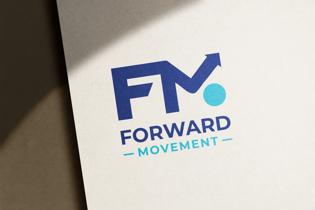 Forward Movement arrow and wordmark identity in navy and cyan on a paper mockup