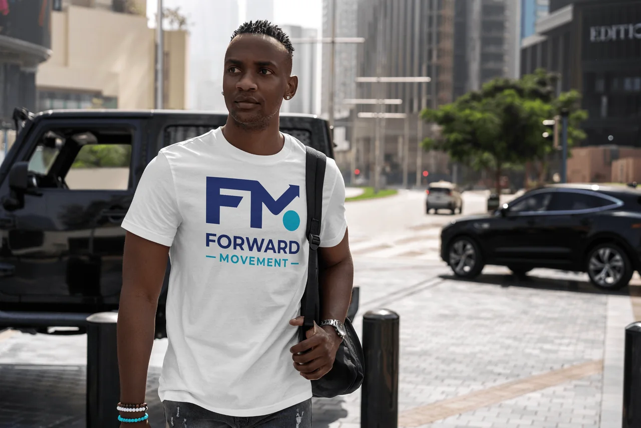 Forward Movement logo on a navy T-shirt worn in a city street mockup